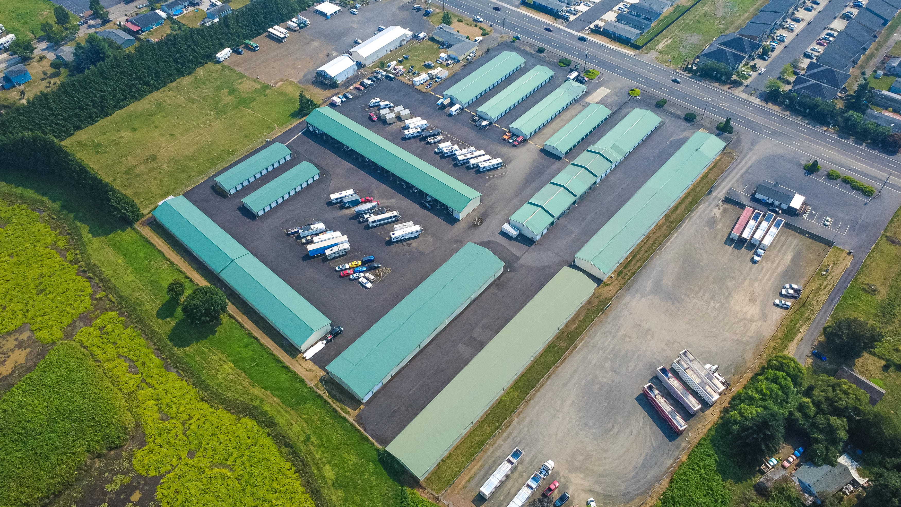 Aerial view of Ocean Beach Self Storage beside wetlands and Ocean Beach Highway in West Longview, Washington